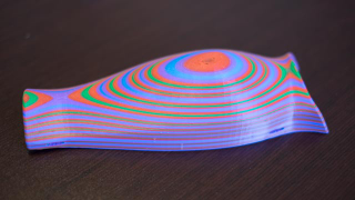 Illustration for article titled This Box Turns Any 3D Printer Into A Multi-Color, Multi-Material Marvel